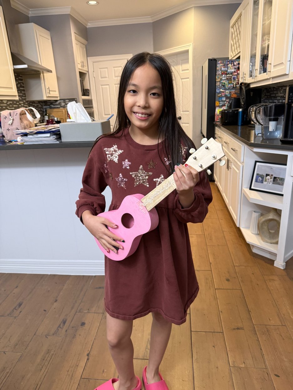 Candice with a musical instrument